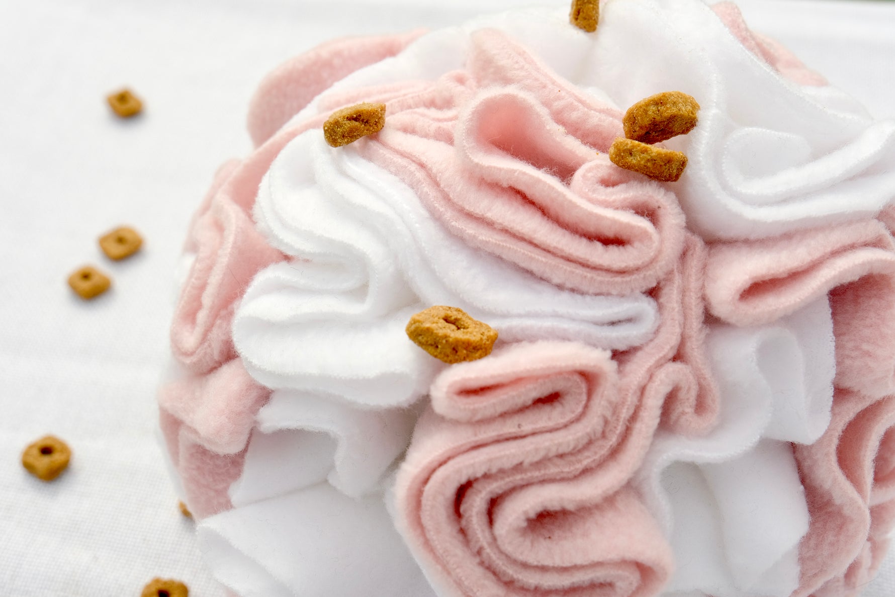 Close-up of Sniffing Ball Light Pink texture and folds for treat hiding